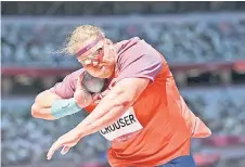  ?? — AFP photo ?? Crouser competes in the men’s shot put final.