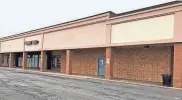  ?? MARCIA GREENWOOD/DEMOCRAT AND CHRONICLE ?? Two vacant store fronts in Irondequoi­t Plaza are being combined into one for a DMV branch office.