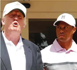  ?? REX ?? All eyes on Tiger: Woods joins Trump at an event in 2014