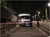  ?? — AP ?? Police officers secure the site of a knife attack in Paris on Monday.