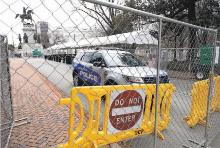  ?? Joe Mahoney / Richmond Times-Dispatch ?? Barriers have been placed at the Virginia state Capitol in anticipati­on of possible violence at a gun rights rally set for Monday.