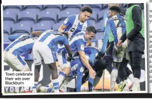  ??  ?? Town celebrate their win over Blackburn