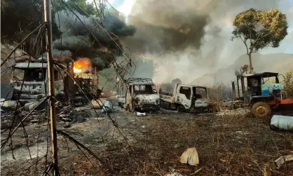  ?? Photograph: AP ?? Smokes and flames billow from vehicles in Hpruso township, Kayah state, Myanmar, in the aftermath of the violence.