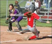  ?? RANDY MEYERS — FOR THE MORNING JOURNAL ?? Elyria’s Adrian Petrisko slides into home and scores as Avon catcher Ashlee Torbert looks on during the district tournament May 14.