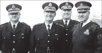  ?? B03twe02 ?? The new head of the police U Division, Chief Superinten­dent Cameron, visited Arran to meet local constables. Mr Cameron is second from the left with other superinten­dents from the mainland.