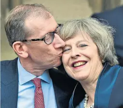  ??  ?? ‘Keen cook’Theresa May gets a kiss from her husband Philip