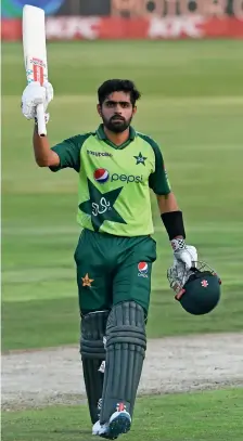  ?? ICC Twitter ?? Pakistan’s Babar Azam celebrates after scoring a century against South Africa in the third T20I match on Wednesday. —