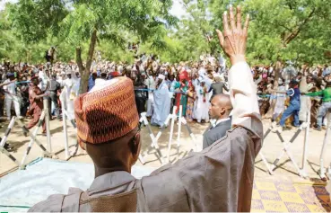  ??  ?? President Muhammadu Buhari waves to a crowd at the Eid Prayer Ground in Daura, Katsina State on Friday State House