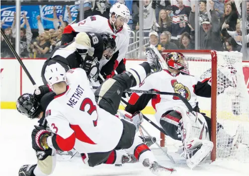  ?? Justin K. Aller/Getty Image s ?? Pittsburgh’s James Neal scores against Ottawa goalie Craig Anderson in the second period of Game 5 in the Eastern Conference Semifinals at Consol Energy Center in Pittsburgh Friday. The Penguins’ 6-2 win gives them the series in five games.