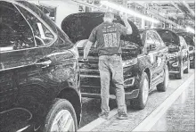  ?? CHRIS YOUNG THE CANADIAN PRESS FILE PHOTOS ?? Ford Edges sit on a production line at the Ford Assembly Plant in Oakville. New NAFTA rules could hurt car sales, a new study says.