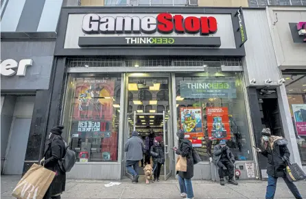  ?? Hiroko Masuike, © The New York Times Co. ?? A GameStop store in Manhattan on Wednesday. GameStop shares have soared 1,500% as millions of small investors, egged on by social media, employ a classic Wall Street tactic to put the squeeze — on Wall Street.