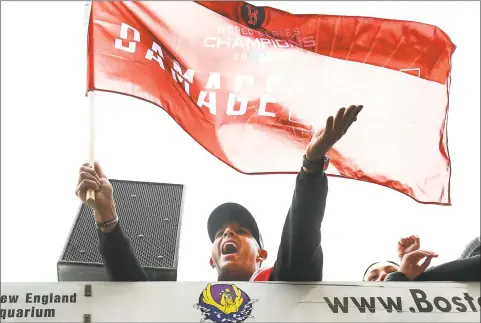  ?? Adam Glanzman / Getty Images ?? Red Sox manager Alex Cora acknowledg­es fans during Boston’s 2018 World Series victory parade on Wednesday.