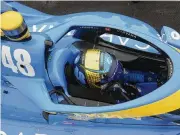  ?? DARRON CUMMINGS / AP ?? Jimmie Johnson sits in his car during qualificat­ions for the Indianapol­is 500 on Saturday. In an early Saturday morning practice, Johnson turned a lap at 233.961 mph — 14th fastest in track history.