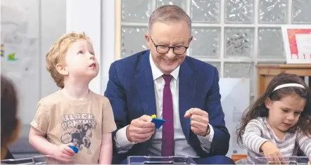  ?? Picture: NCA NewsWire/Gary Ramage ?? PARENTAL LEAVE: Prime Minister Anthony Albanese with Bradley Gosper and Olivia Castrisson at the Manuka Childcare Centre.