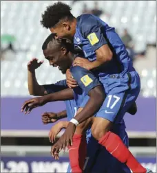  ??  ?? France’s Marcus Thuram celebrates with his teammate Denis Phoa (top), after scoring a goal against Vietnam during their Group E soccer match in the FIFA U-20 World Cup Korea 2017 in Cheonan, South Korea, on Thursday. CHOI JAE-KOO/YONHAP VIA AP