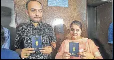  ?? PTI FILE ?? Mohammad Anas Siddiqui and Tanvi Seth show their passports issued to them by the Regional Passport Office in Lucknow.