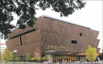  ?? Alex Wong/Getty Images ?? The National Museum of African American History and Culture opened Sept. 1, 2016. The museum was establishe­d by an Act of Congress in 2003.