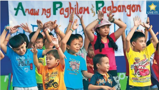  ??  ?? Children from Manila, including those living at evacuation centers for typhoon victims, perform during a day of healing and recovery for Yolanda-hit areas at the Museo Pambata in Manila yesterday. Related story on Page 3.
EDD GUMBAN