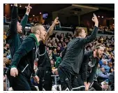  ?? CONTRIBUTE­D BY JOSEPH CRAVEN ?? The Wright State bench cheers on an 80-67 win Thursday at Green Bay as the Raiders rise to 7-0 in the Horizon League.