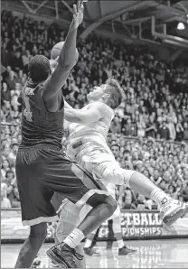  ?? ASSOCIATED PRESS ?? Duke's Grayson Allen drives in for the winning shot as Virginia's Marial Shayok applies defensive pressure.