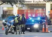  ?? JOE CAVARETTA/STAFF PHOTOGRAPH­ER ?? Florida Highway Patrol troopers joined Broward Sheriff's Office deputies in guarding Stoneman Douglas Thursday.