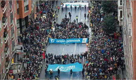  ?? — AFP ?? Closer to home: Participan­ts asking for support during a demonstrat­ion to demand the transfer of ETA prisoners to jails near their homes in the northern Spanish city of Bilbao.