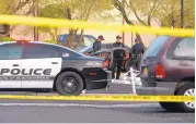  ?? GREG SORBER/JOURNAL ?? Albuquerqu­e police stand at the scene of an officerinv­olved shooting at a Southeast Albuquerqu­e apartment complex that left one man dead. According to a spokesman, police were dispatched to the complex in response to reports that shots had been fired.