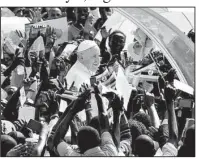  ?? AP/GIUSEPPE CACACE ?? Crowds greet Pope Francis on Saturday at the Kololo airstrip in Kampala, Uganda. He told Ugandans, “In your veins runs the blood of martyrs, and for this reason you have such a strong faith.”