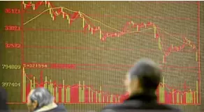  ?? —AP ?? SELLOFF A Chinese investor in Beijing monitors stock prices which tumbled all over the world amid fears of a trade war.