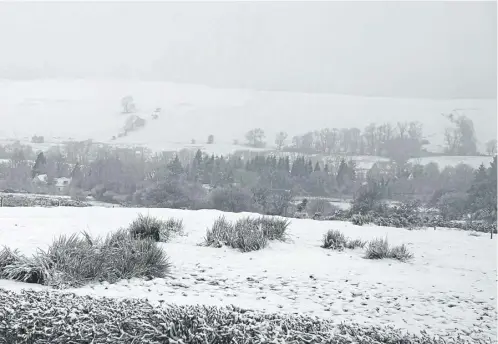  ?? ?? Reader Sue Wilson photograph­ed this snowfall in Aberfoyle yesterday morning. A yellow warning for snow had been in place on Friday, with several areas of Scotland seeing the white stuff