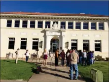  ??  ?? COMMUNITY MEMBERS MILL AROUND the entrance of the old City Hall. The building turns 100 years old in 2020 and requires many repairs. The Yuma Crossing National Heritage Area announced a fundraisin­g campaign to restore the building and other areas under the jurisdicti­on of the organizati­on.