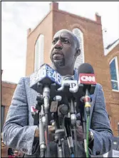  ??  ?? “Let the message go out that we will not be shaken by this,” the Rev. Raphael Warnock of Ebenezer Baptist Church said Thursday. “We will not be intimidate­d.”