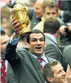  ??  ?? Golden moment: Martin Johnson with the 2003 World Cup