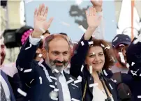  ?? Reuters ?? Newly elected Prime Minister of Armenia Nikol Pashinyan greets supporters in Republic Square in Yerevan on Tuesday. —