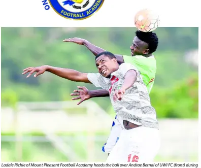  ?? GLADSTONE TAYLOR/ MULTIMEDIA PHOTO EDITOR ?? Ladale Richie of Mount Pleasant Football Academy heads the ball over Andrae Bernal of UWI FC (front) during a Red Stripe Premier League match at University of the West Indies last season.