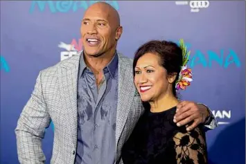  ?? Willy Sanjuan / Associated Press ?? Dwayne Johnson, with his mother Ata Johnson at the 2016 “Moana” premiere in Los Angeles. His mother survived an early Thursday morning car accident, and the actor said “angels of mercy watched over” her.