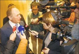  ?? Michel Euler Associated Press ?? MARKUS DIETHELM, UBS Group’s general counsel, speaks with reporters after the bank was ordered to pay $5.1 billion. UBS said it would appeal the ruling.