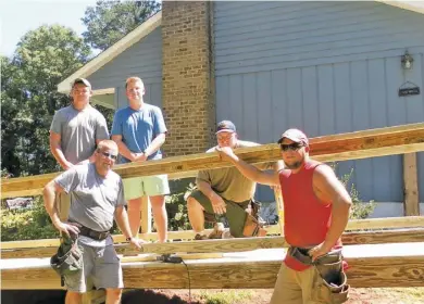  ?? BY CAMILLE RACER ?? While volunteers from Habitat for Humanity have started to reconstruc­t Gary Jenkins Jr.'s bedroom, doorways and bath to make them more accessible, Racer Constructi­on members have volunteere­d to build the ramp, with materials donated by MWP in Madison,...