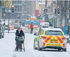  ??  ?? Wintry scenes in the Hilltown area of Dundee, left, and Perth – and more snow is forecast over the coming days.