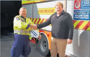  ??  ?? Eketahuna Fire Chief Max Mayer, pictured with AFFCO buyer Daniel Stephens, said the brigade was able to buy some new helmet torches with their donation last year.