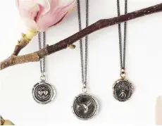  ??  ?? Pyrrha’s sustainabl­e jewelry offerings include talismans.