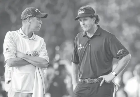  ?? JD MERCER, USA TODAY SPORTS ?? Phil Mickelson, right, with caddie Bones Mackay on Sunday, shot a final- round 74 and finished as U. S. Open runner- up for the sixth time.