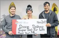  ?? GLEN WHIFFEN/THE TELEGRAM ?? Diane Bishop of Mount Pearl is presented with her cheque after winning a $1.5-million Super Set for Life jackpot. Joining her for the presentati­on at the Atlantic Lottery Corp. office in St. John’s were her sons Shane Parsons (left) and Jordan Parsons....