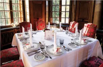  ??  ?? CLOCKWISE FROM TOP The wood-panelled Dining Hall of Saareck Castle; dinner is served on Villeroy & Boch’s Classica Contura bone china with patterns inspired by classical architectu­re; a view of the castle’s rich interiors
OPPOSITE The ivy-covered...