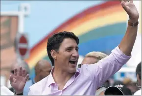  ?? CP PHOTO JUSTIN TANG ?? Prime Minister Justin Trudeau marches in the Ottawa Capital Pride parade, Sunday, Aug. 27, 2017. The apology from Trudeau for past state-sanctioned discrimina­tion against LGBTQ people is welcome news for those who have been calling for such an...