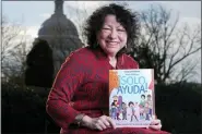  ?? CAROLYN KASTER — THE ASSOCIATED PRESS ?? Supreme Court Associate Justice Sonia Sotomayor holds her new children’s book “Just Help!” on Capitol Hill in Washington, Wednesday.