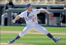  ?? AP FILE ?? Los Angeles Dodgers pitcher Trevor Bauer is the highest-paid player in 2021 at $38 million after agreeing to a $102 million, three-year contract he can terminate after one season.