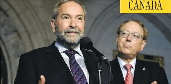  ?? JUSTIN TANG / THE CANADIAN PRESS ?? NDP Leader Tom Mulcair has reiterated his stance that MP Murray Rankin, right, is his party’s only candidate to sit on the federal committee on national security and intelligen­ce, despite Prime Minister Justin Trudeau’s request that the NDP submit four...