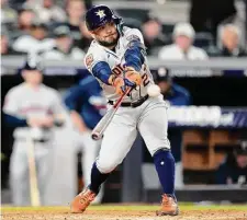  ?? Brett Coomer/Staff photograph­er ?? Jose Altuve doubles off New York’s Gerrit Cole to break his 0-for-25 postseason streak during the fifth inning of Game 3.