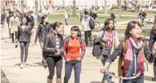  ?? | AP FILE PHOTO ?? Students walk through the University of Illinois at Urbana- Champaign quad in 2015.